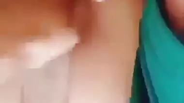 Horny girl squeezes her boobs and fingers her hairy pussy