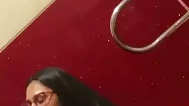 Chubby girl gives an outdoor blowjob in a cinema theatre